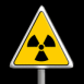 Signe Radioactif dans un panneau danger sur fond noir