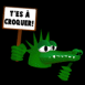 Crocodile tenant une pancarte "T'es  croquer!"